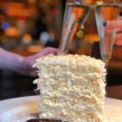 

<p>A slice of coconut cake at Ocean Prime is a great way to end your meal.</p>
<p>“><figcaption class=