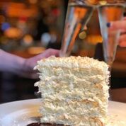 

<p></noscript>A slice of coconut cake at Ocean Prime is a great way to end your meal.</p>
<p>“><figcaption class=