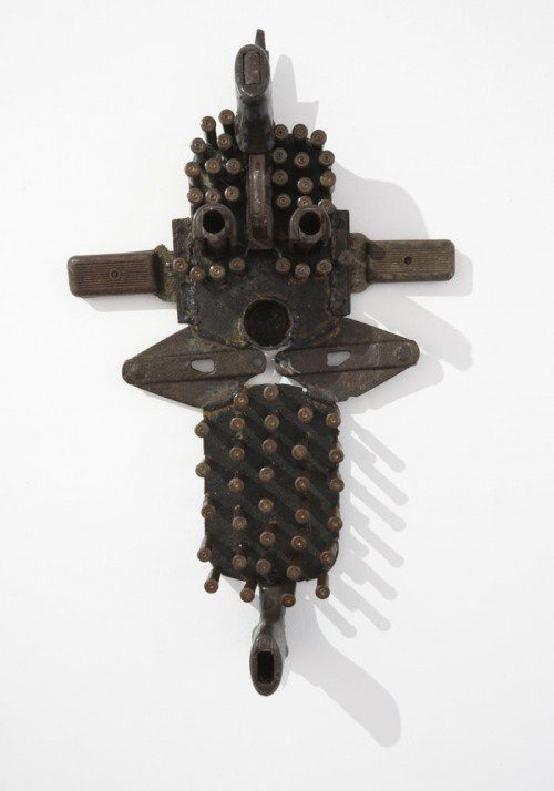 

<p>A mask from Goncalo Mabunda’s recent exhibition in London. The works are made from guns, bullets and other military equipment recovered from the community under a program run by the Christian Council of Mozambique.</p>
<p>“><figcaption class=