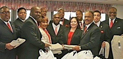 The Indianapolis Alumni Chapter donated school uniforms to the Kappa Closet at IPS #42. Pictured front row left to right: Snow; Eugene Murray; Deloris Sangster, principal of the school; Martin Hill; Jennifer Botts, the school’s elementary director; Dwayne Murray; and White. Second row left to right: Kevin Adams; Bates; Lee Morgan; Chuck Carr Brown; and Smith. (Photos/L. Blaylock)