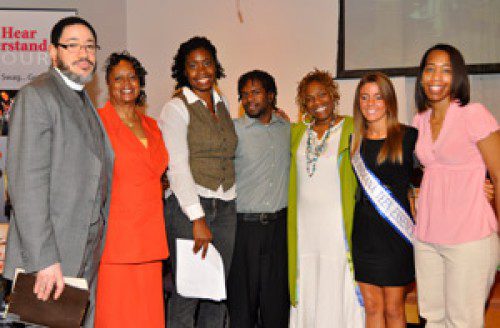 First Freewill Pastor Charles Sheppard, his wife Michelle and Deidra Coleman of the Indianapolis Urban League join participants. 