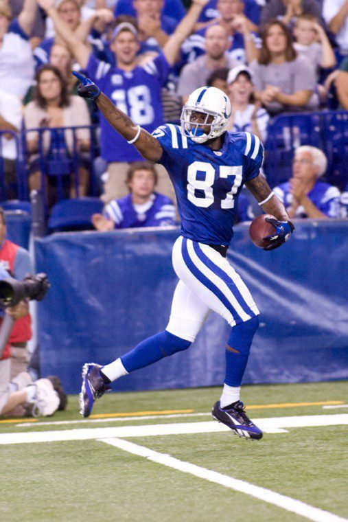 COLTS # 87 REGGIE WAYNE  GETS BEHIND THE GREEN BAY DEFENSE  TO CATCH THIS TOUCH DOWN PASS.