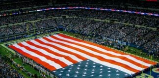 bird's eye view of US flag on football field