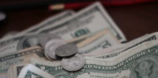 photo of dollar coins and banknotes