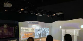 Guests view an eduational video detailing the story of Emmett Till at the "Emmet Till & Mamie Till-Mobley: Let the World See" exhibit at the Children's Museum of Indianapolis