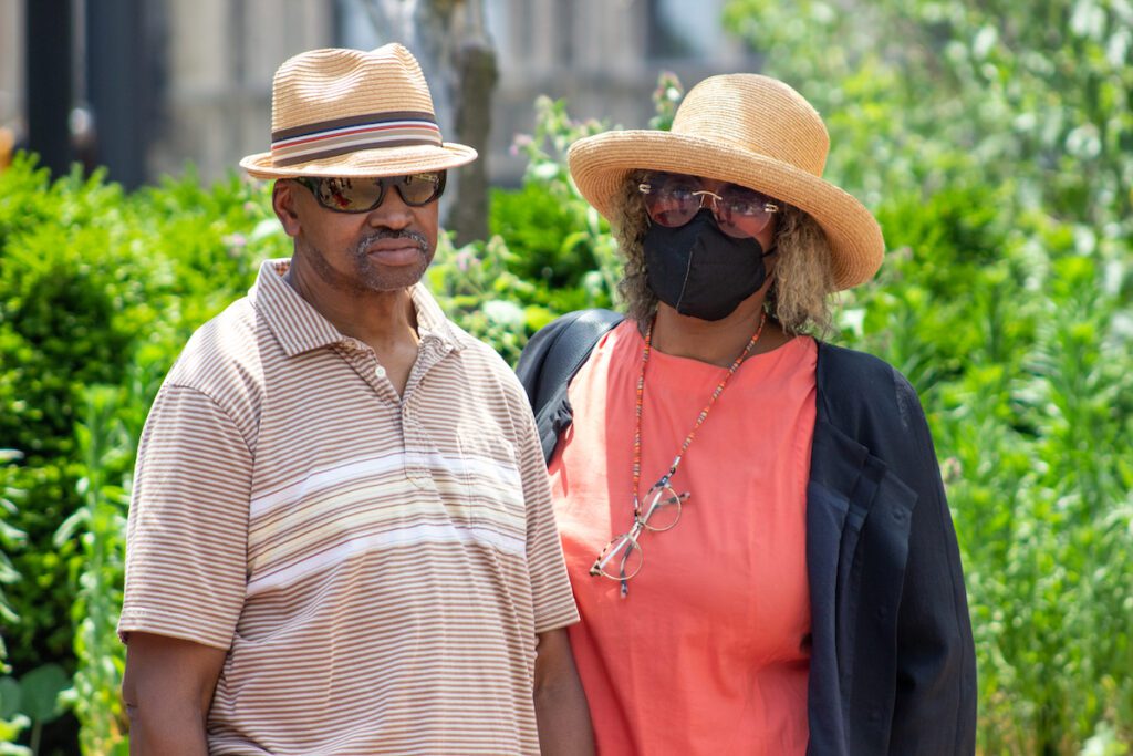 Herman Whitfield Jr. (left) and Gladys Whitfield (right) stand at a press conference July 1, 2022, outside of City Market. They are the parents of Herman Whitfield III, who died in police custody in April. (Photo/Tyler Fenwick)