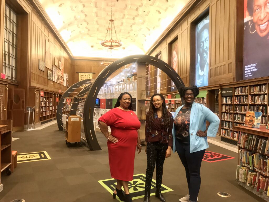 (L to R) Nichelle M. Hayes, IndyPL Interim CEO, Amira Malcom, Interim Manager odf the Center for Black Literature & Culture and Briana Metzger, RLR associates, inside of the CBLC.