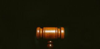 brown wooden stand with black background