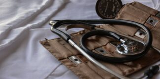 black stethoscope with brown leather case