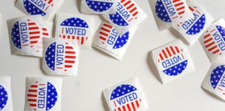 Voted printed papers on white surface