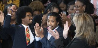 Expelled Rep. Justin Pearson, D-Memphis, from left, expelled Rep. Justin Jones, D-Nashville, and Rep. Gloria Johnson, D-Knoxville, are recognized by the audience at Fisk University before Vice President Kamala Harris arrives, Friday, April 7, 2023, in Nashville, Tenn. (AP Photo/George Walker IV)