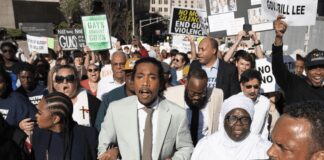 State Rep. Justin Jones, D-Nashville, center, marches with supporters to the state Capitol Monday, April 10, 2023, in Nashville, Tenn. (AP Photo/George Walker IV)