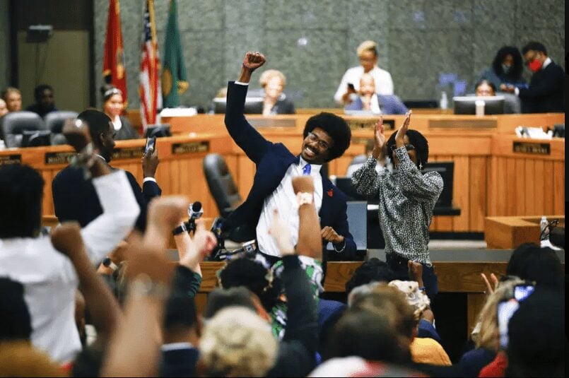 Justin Pearson celebrates with supporters after being reinstated to the Tennessee House of Representatives by the Shelby County Board of Commissioners building in Memphis, Tenn., on Wednesday, April 12, 2023. (Chris Day/The Commercial Appeal via AP)