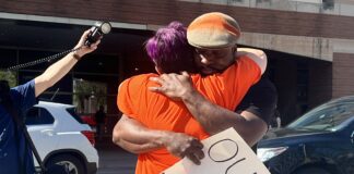 Activist, Jauston “TheKingTrill” Huerta hugging a fellow protester these are our children