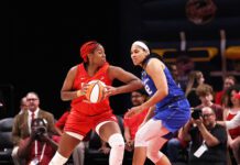 No. 1 overall 2023 WNBA Draft pick and Rookie of the Month winner Aliyah Boston (7) using physicality to create space against Connecticut Sun forward Brionna Jones (42) during the Indiana Fever home opener on May 19 2023. (Photo/David Dixon)