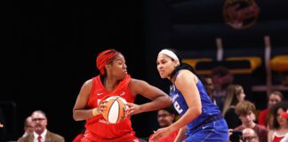 No. 1 overall 2023 WNBA Draft pick and Rookie of the Month winner Aliyah Boston (7) using physicality to create space against Connecticut Sun forward Brionna Jones (42) during the Indiana Fever home opener on May 19 2023. (Photo/David Dixon)