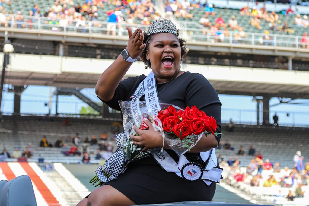 Festival 500 Queen Scholar winner Mykah Coleman, Indianapolis, waving to the fans at the Indianapolis Motor Speedway. (Photo/ Aaron Skillman)