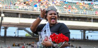 Festival 500 Queen Scholar winner Mykah Coleman, Indianapolis, waving to the fans at the Indianapolis Motor Speedway. (Photo/ Aaron Skillman)