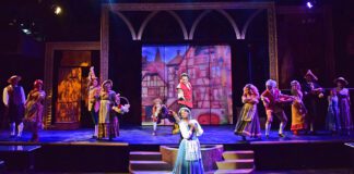 The townspeople sing about the odd girl that is "Belle" (Jameelah Leaundra) in Beef & Boards Dinner Theatre's production of Disney's “Beauty and the Beast,” now on stage through July 9.