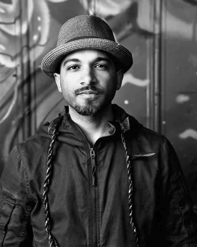 Elio Mercado, a Dominican artist from South Florida painted the mural of Black Arts Movement poet Etheridge Knight. (Photo provided/Indy Arts Council)