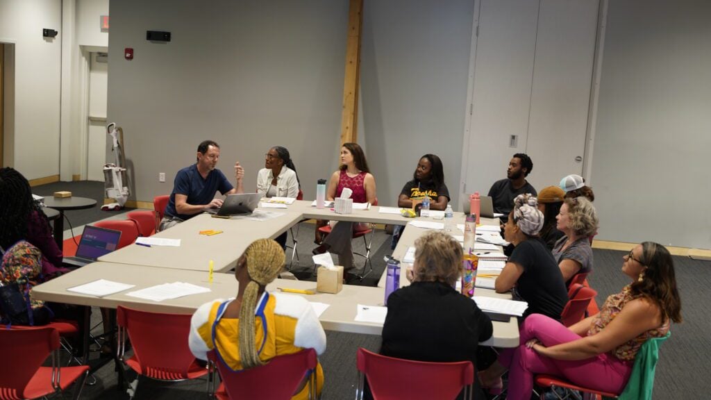 The cast of NAATC’s “Detroit ‘67” sitting for the first table read. (Photo/Jordan Leigh Artistry)