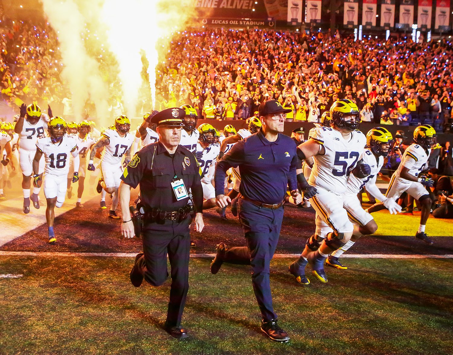 University of Michigan players and coaching staff take the field during the Big Ten Championship Football Game at Lucas Oil Stadium in downtown Indianapolis in December of 2023. (Photo/David Dixon)