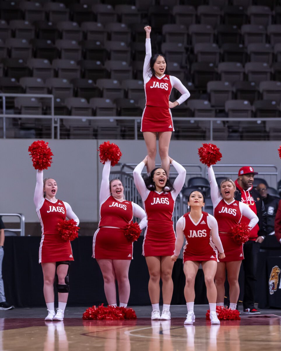 The IUPUI Jaguars Cheer squad getting the crowd at Indiana Farmers Coliseum hyped during their matchup against the Robert Morris Colonials on January 20, 2024. (Photo/Walt Thomas)