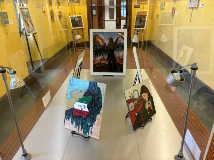 Many of the artists who created the work displayed in the "Iran in Revolt" exhibit wish to remain anonymous to protect their safety. (Photo/Chloe McGowan)