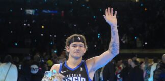 Osceola Magic's Mac McClung waves after winning the slam dunk competition at the NBA basketball All-Star weekend, Saturday, Feb. 17, 2024, in Indianapolis. (AP Photo/Darron Cummings)