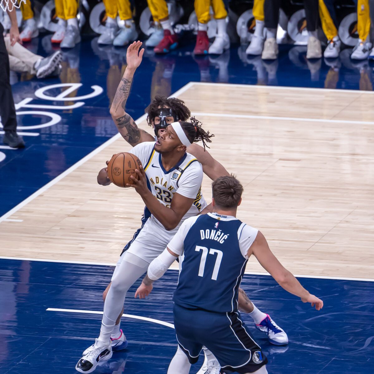 Indiana Pacers center Myles Turner (33) splits the Dallas Mavericks defenders in the paint during their matchup at Gainbridge Fieldhouse, located in Downtown Indianapolis, IN., on February 25, 2024. (Photo/Walt Thomas)