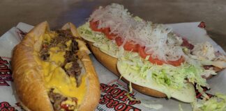 a photo of the Philly Cheesesteak with Cheese Whiz (left) and the Brotherly Love sandwich (right) at Hoagies and Hops in Butler Tarkington, taken on February 17, 2024 during NBA All-Star Weekend. (Photo/Noral Parham III)