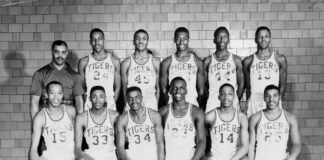 Front row left to right: Stanford Patton, Sam Milton, Bill Brown, Bill Scott, Johnny Mack Brown. Back Row: Coach Ray Crowe, Willie Merriweather, John Gipson, Oscar Robertson, Sheddrick Mitchell, Willie Burnley. (Photo/Indiana Historical Society)