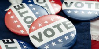Democrat vs republican poll, democratic decision and primary voting conceptual idea with Vote election campaign button badges and the united states of america flag (Photo/Getty Images)