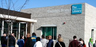Residents and community members wait patiently outside the new Glendale Branch for its grand opening on March 30, 2024. (Photo/Curtis Guynn)