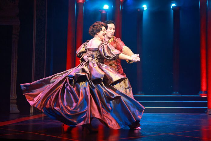 Anna (Hannah Louise Fernandes) and the King (Jae Woo) perform “Shall We Dance” in Beef & Boards Dinner Theatre’s production of Rodgers and Hammerstein’s The King and I, now on stage through May 19. (Photo/Indy Ghost Light)