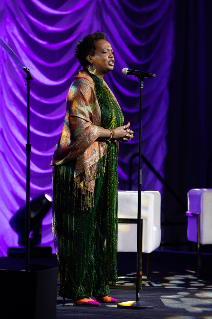 Manon voice, multi-hyphenated artist and educator, reciting spoken word poetry for the Women’s Fund of Central Indiana - The Power of Women (Photo provided/Manon voice)