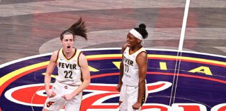 Indiana Fever guards Caitlin Clark, left, and Erica Wheeler celebrating after Clark's big basket to take the lead during their game against the Connecticut Sun on May 20 2024. (Photo/David Dixon)