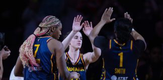Indiana Fever guard Caitlin Clark (22) is introduced before the team's preseason WNBA basketball game against the Atlanta Dream in Indianapolis, Thursday, May 9, 2024. (AP Photo/Darron Cummings)