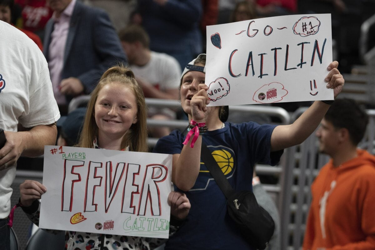 Fans hold up signs before an WNBA preseason basketball game between the Indiana Fever and the Atlanta Dream, Thursday, May 9, 2024, in Indianapolis. (AP Photo/Darron Cummings). Photo used for story on Atlanta Dream versus Indiana Fever preseason game on May 9, 2024 at Gainbridge Fieldhouse.