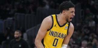 Indiana Pacers guard Tyrese Haliburton (0) reacts during the fourth quarter of Game 1 of the NBA Eastern Conference basketball finals against the Boston Celtics, Tuesday, May 21, 2024, in Boston. (AP Photo/Charles Krupa)