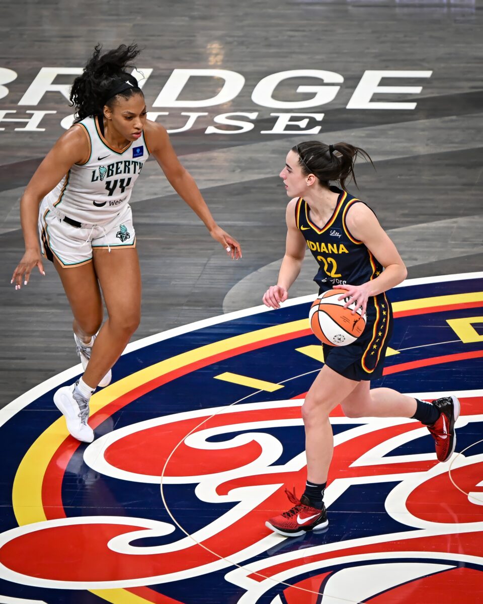 Indiana Fever rookie Caitlin Clark (22) brings the ball up against New York Liberty guard Betnijah Laney-Hamilton (44) during the Indiana Fever WNBA regular season home opener at Gainbridge Fieldhouse in downtown Indianapolis on May 16, 2024. (Photo/Darnell Scott)
