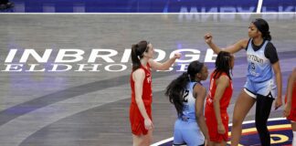 Angel Reese and Caitlin Clark during a WNBA game.