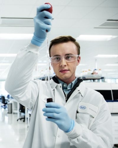 A man performs a scientific experiment in a lab