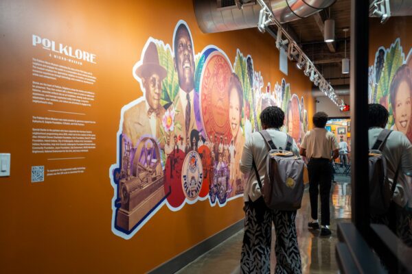 At the entrance to the Polklore Micro-Museum, a mural painted by Cierra Johnson features a collage of the people and artifacts who make up the history of Martindale-Brightwood.