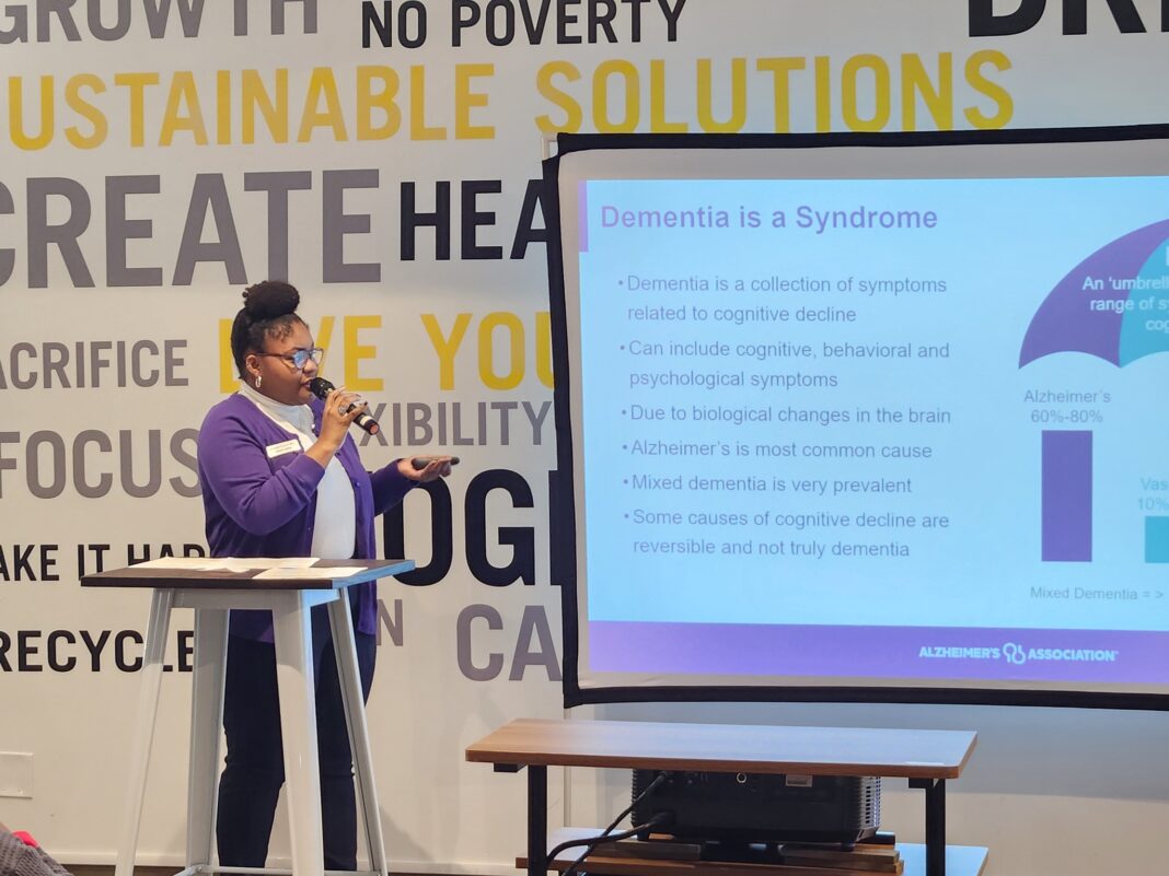 Woman giving a presentation about dementia and Alzheimer's awareness