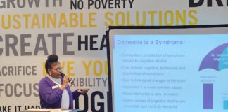 Woman giving a presentation about dementia and Alzheimer's awareness
