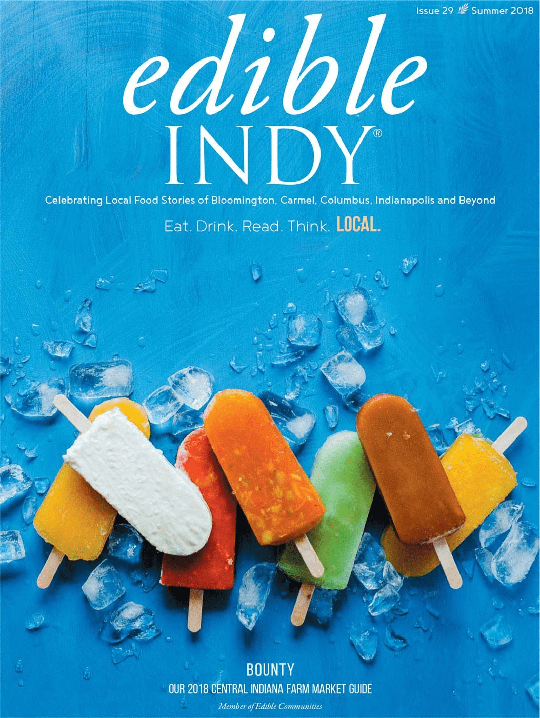 An image of different colored popsicles against a blue background