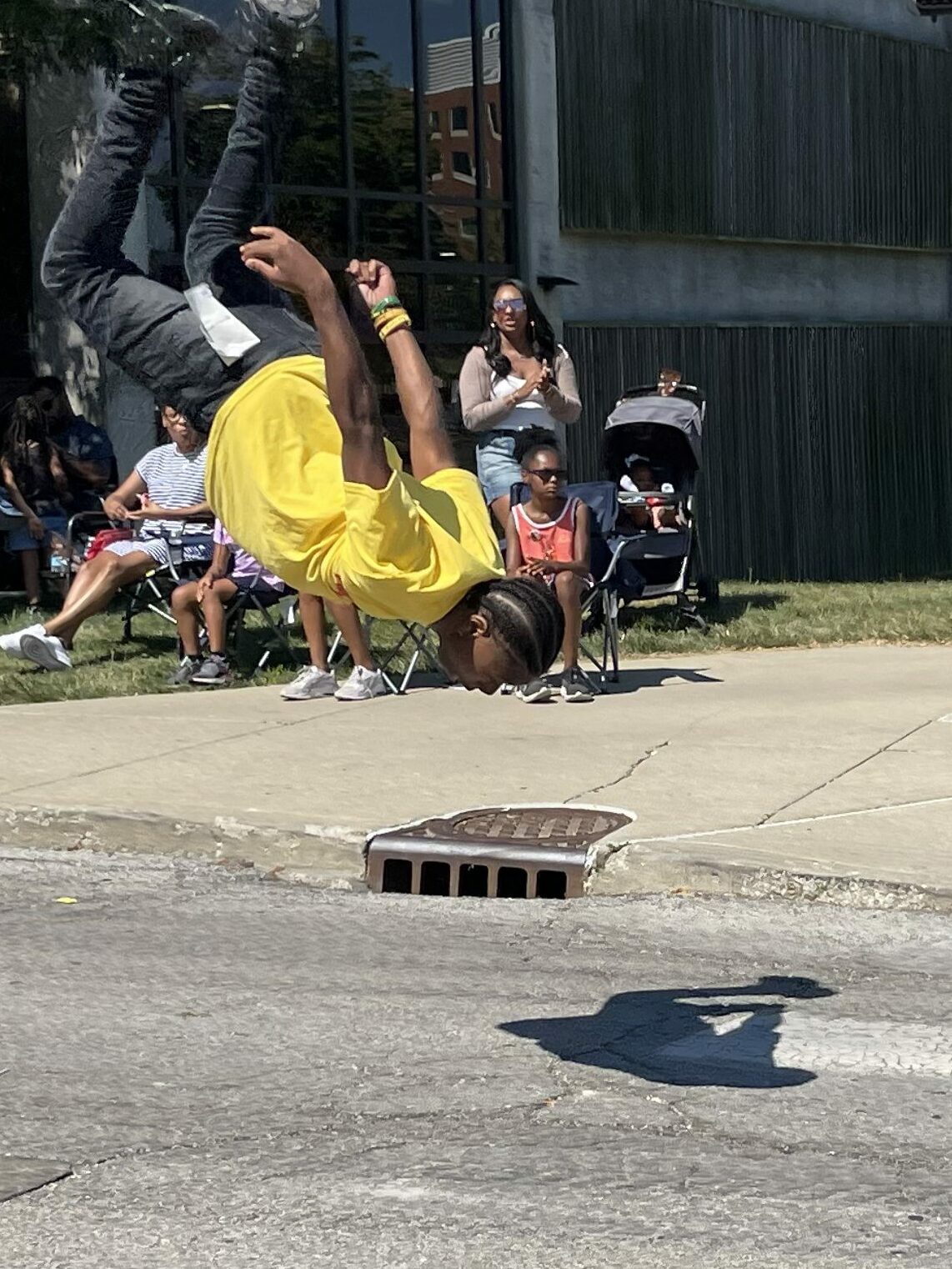 Parade entertainer performs back flip. Indy Juneteenth 2024.