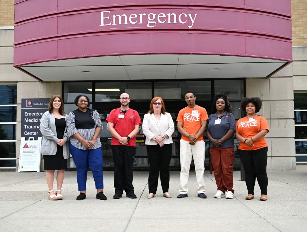 people standing in front of hospital