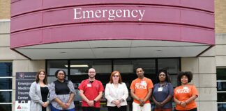 people standing in front of hospital
